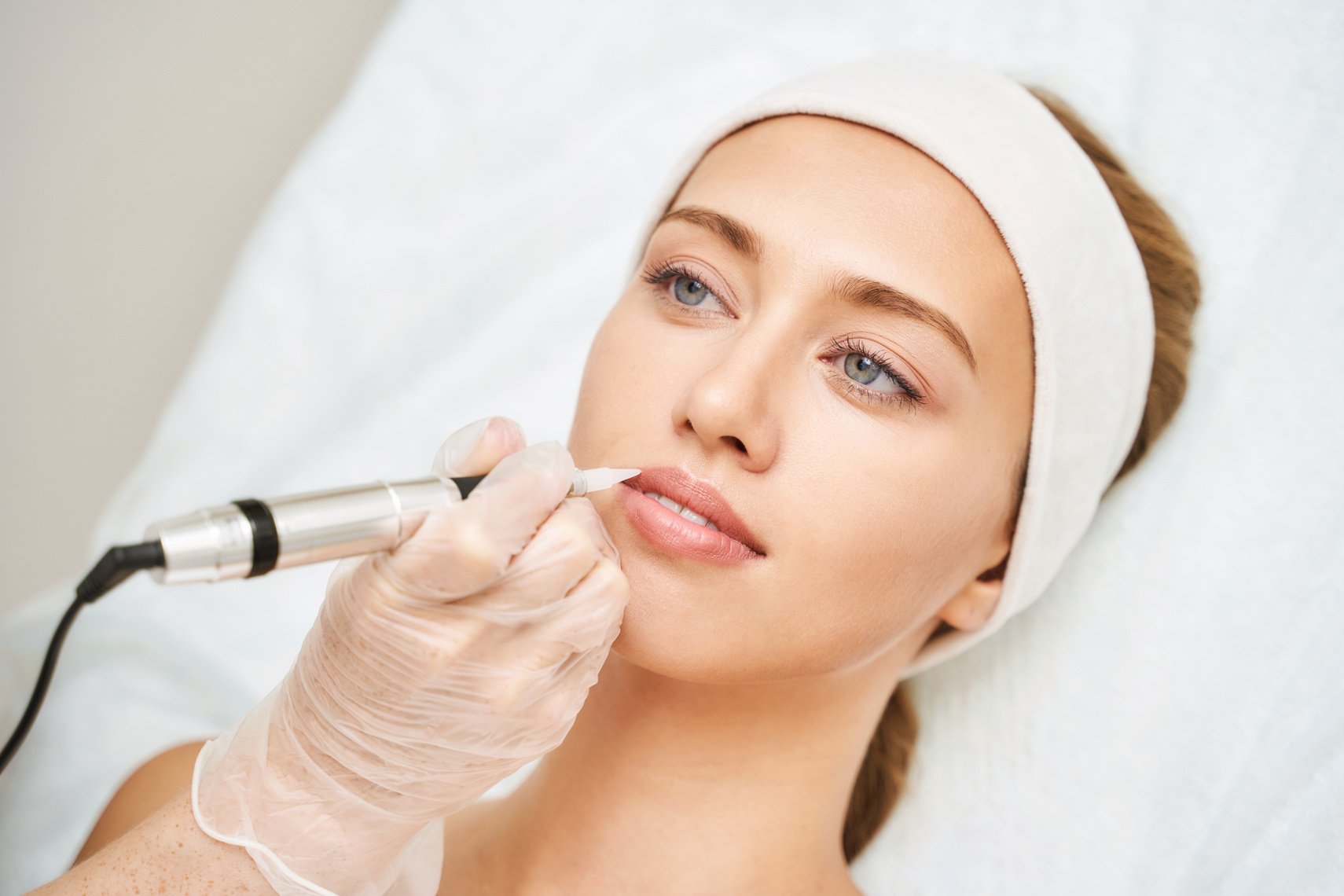 Woman Getting a Permanent Lip Tattoo 